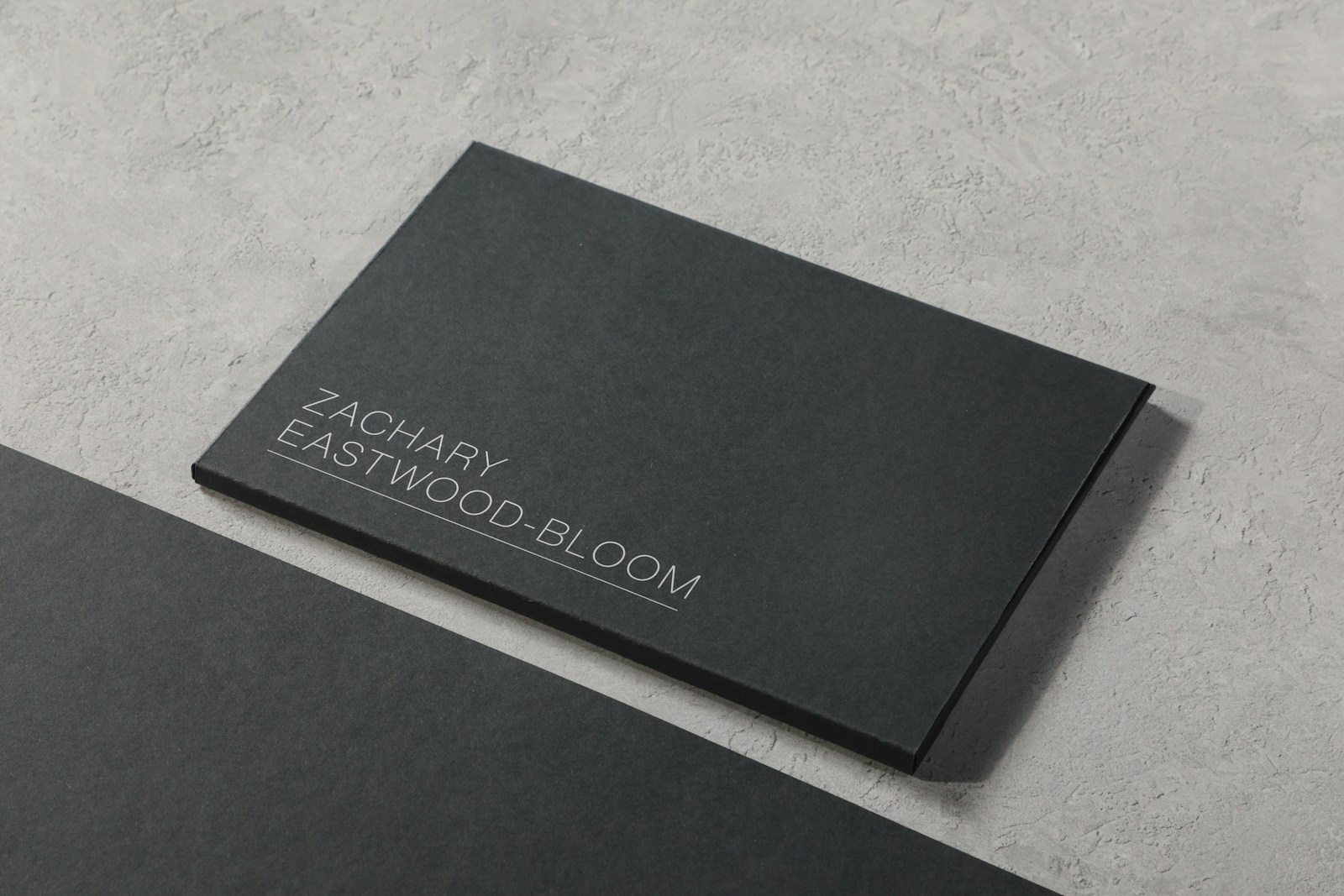 A black business card sitting on top of a table